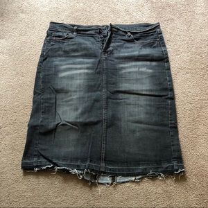 Distressed black denim skirt